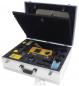 Preview: The image shows an opened aluminum toolbox. It contains various measuring devices, cables, and accessories, securely embedded in foam. The case has a convenient handle.