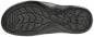 Preview: The image shows the underside of a shoe. The sole is black and features a textured, non-slip pattern with various grooves and profiles for good traction.