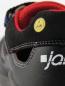 Preview: The image shows the heel of a shoe in black with red accents. A yellow emblem indicates the ESD function. The lettering "ja..." is visible on the side.