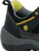 Preview: The image shows a part of a shoe. It is predominantly black with gray and yellow accents. The surface appears textured, and the sole is designed to be stable and robust.