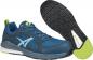 Preview: The image shows a blue sports shoe with a mesh upper and green accents. The sole is black with a grippy pattern for better traction. The shoe is lightweight and modern.