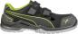 Preview: The shoe is sporty and primarily black with green accents. It has two Velcro straps and a sturdy rubber sole. The front features ventilation slots for good airflow.