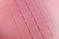 Preview: The image shows a structured, pink surface with parallel, slightly notched lines. These lines run in a regular pattern and create a tactile texture.