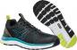 Preview: The image shows a black sports shoe with teal accents. The shoe has a flexible, textured sole and a cushioned insole that provides comfort and support.