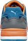 Preview: The image shows the rear view of a blue sports shoe with gray and orange accents. The shoe has a soft, padded heel and a textured sole.