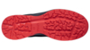 Preview: The image shows the underside of a shoe. The sole is black with a red tread. The pattern consists of irregular indentations and cleats that provide good traction.