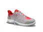 Preview: The shoe is sporty, primarily gray with red accents. It has a flat, non-slip sole and a breathable upper structure. The laces are visible.