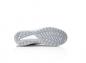 Preview: The image shows the underside of a gray sports shoe. The sole features a textured pattern with grooves and studs for better grip. The background is neutral and bright.