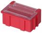 Preview: The image displays a red plastic box with a transparent lid. It has a rectangular shape and vertical ridges on the sides for better grip.