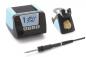 Preview: The image shows a soldering iron with a digital temperature display, a tool stand, and a cleaning device, all in black and blue. The soldering iron has a fine tip.