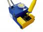 Preview: The image shows a blue soldering iron stand with a yellow holder. A soldering iron is inserted in the holder, next to it is a round cleaning brush.