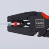 Preview: The image shows a black wire stripper from Knipex. The pliers have a red grip accentuation and a mechanism for stripping wires.