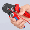 Preview: The image shows a hand holding a red and blue pair of pliers. The pliers are used for stripping wires, with a red cable currently being clamped.