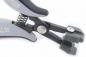 Preview: The image shows a pair of pliers with gray and black plastic handles. It has a spring tension and at the front, a specially shaped strong clamp.