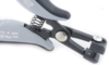 Preview: The image shows a gray pair of pliers that has a spring mechanism. The handles are ergonomically shaped and the head has a small opening for working with cables or wires.