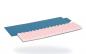 Preview: The image shows a folded sleeping pad with a wavy, pink surface on top and a smooth, blue side on the bottom. The mat is lightweight and suitable for outdoor activities.