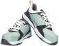 Preview: The image shows a pair of athletic shoes. They are primarily mint green, with black and white accents. The laces are white, and there is a small orange loop at the back.