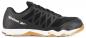 Preview: The shoe is a sporty, black sneaker by Reebok. It has a smooth surface with a rubberized sole and a white midline. The laces are placed on top.