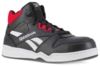 Preview: The shoe is a black basketball shoe with red accents. It features high lacing, a rubber sole, and a prominent logo on the side. The surface is made of leather.