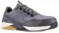 Preview: The shoe is a gray fitness shoe with a textured surface, flat sole, and sturdy, lightweight material. The laces are dark gray, and the sole has white and gold accents.