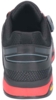 Preview: The image shows the rear view of a black sports shoe with red accents. It features a breathable upper, a padded tongue, and a grippy sole.