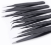 Preview: The image displays an arrangement of eight black tweezers, designed in various shapes and sizes. They are made of stainless steel and are intended for precise work.