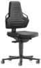 Preview: The chair is black and has an ergonomic backrest with a textured surface. It has armrests and rolls on a five-wheeled base. The seat height is adjustable.