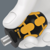 Preview: The image shows a hand holding a black screwdriver with yellow patterns. The handle is ergonomically shaped, with a gray area in the background.