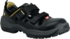 Preview: The shoe is black with two wide Velcro straps. It has a sturdy sole and reinforced toes. Some yellow accents are visible, and the fabric is breathable.