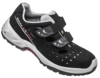 Preview: The image shows a black shoe with two wide Velcro straps. The shoe has side ventilation holes and a grippy, beige-colored sole. It appears sporty and comfortable.