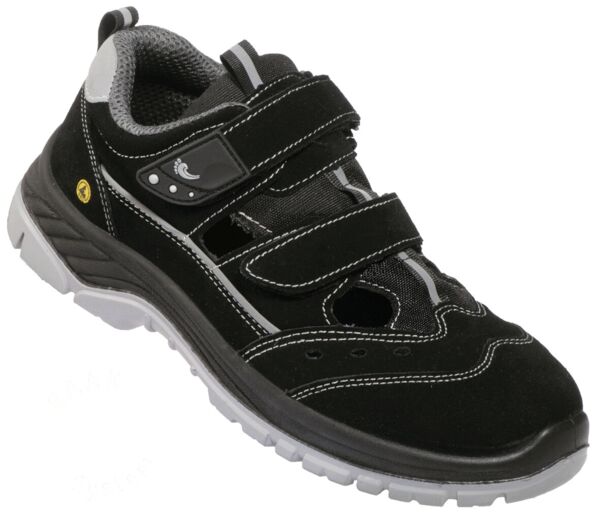 The shoe is a sporty, black sneaker with gray and white accents. It has three Velcro straps and a gray treaded sole. The upper is made of a soft, textured material.