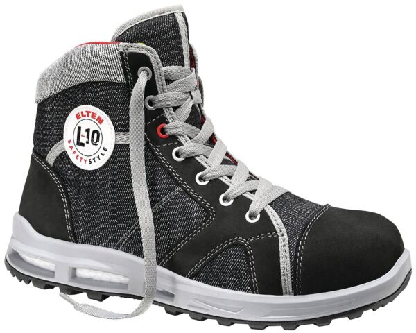 It is a robust, high-cut shoe in black and gray. The laces are gray, with a white sole and a round, red-white logo on the side.