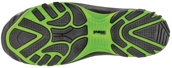 The image displays the underside of a sports shoe. The sole features a grippy pattern with black and green areas, ensuring good traction.