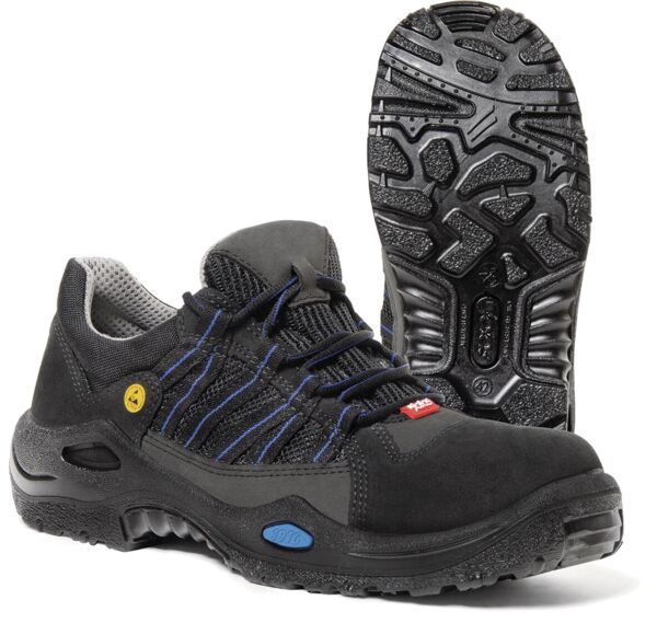 The image shows a black safety shoe with a non-slip sole. It features gray details, braided laces, and a breathable lining. Robust and sporty in design.