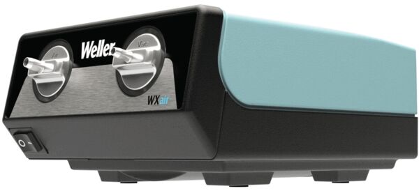 The image displays a black and turquoise device with two round knobs on the front. It reads "Weller WXair". It has a smooth surface and a rectangular shape.