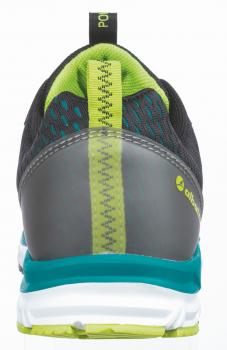 The image shows the back of a sports shoe. The shoe has a dark, gray color with green and turquoise accents. The sole is thick and heavily textured, providing good grip.