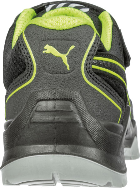 The image shows the back of a black sports shoe with a green accent. The Puma logo is displayed on the heel. The sole structure is sturdy and provides good grip.