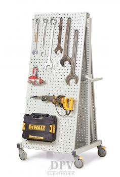 The image displays a tool rack with various tools, including wrenches, pliers, and a drill. Below, there is a yellow toolbox.