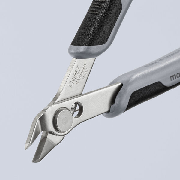 The image shows a pair of pliers with sharp, downward-curved blades. The handle is black with gray elements. The brand "Knipex" is engraved on the blade area.