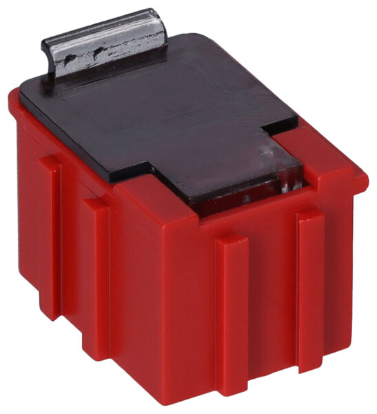 The image shows a red, rectangular plastic block with a black top. There is a metal clip on the top. The block has vertical grooves on the sides.