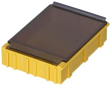 The image shows a rectangular, yellow container with a transparent, dark lid. The container has a textured surface and is flat.