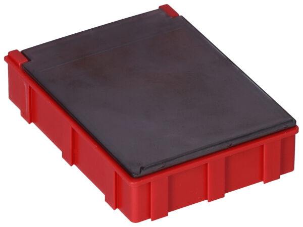 The image shows a rectangular box that is red with a glossy black top. It has rough edges and a slightly textured surface. The box is flat and compact.