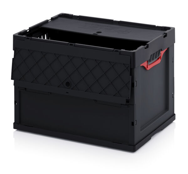 The image shows a black plastic box. It has a square shape with a top lid and one side featuring a diamond-shaped structure. A red handle is visible.