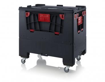 It is a black plastic box with red handles and accents. It is rectangular, has a smooth surface, and stands on four wheels for easy mobility.