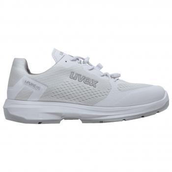 The image shows a sporty, white shoe by Uvex. It features a modern design with mesh material for breathability, a flat sole, and simple laces.