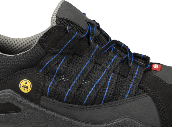 The image shows a black work shoe with blue shoelaces and a gray upper. The sole is robust, and there is a yellow ESD symbol on the side.