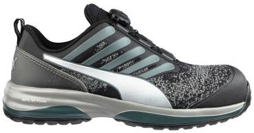 The shoe is sporty and features a top black with gray and silver accents. The sole is thick and stable. It has a quick lacing system and is suitable for versatile activities.