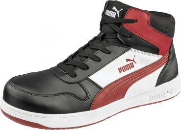 The shoe is a mid-top sneaker with a black leather upper. It features red and white accents and a sturdy, white sole. Laces and the Puma logo are also visible.