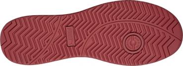 The image shows the underside of a shoe in dark red. The pattern consists of waves and grooves designed to provide good grip. In the center is a circular element.