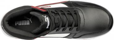 The image shows a black sports shoe with lace-up upper. On the side, there is a white stripe and the Puma logo in the middle. The sole is white.